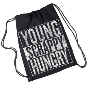 May include: Black drawstring backpack with the words "YOUNG SCRAPPY HUNGRY" printed in white block letters. The bag has black drawstrings and a simple design. The bag is made of a soft material.