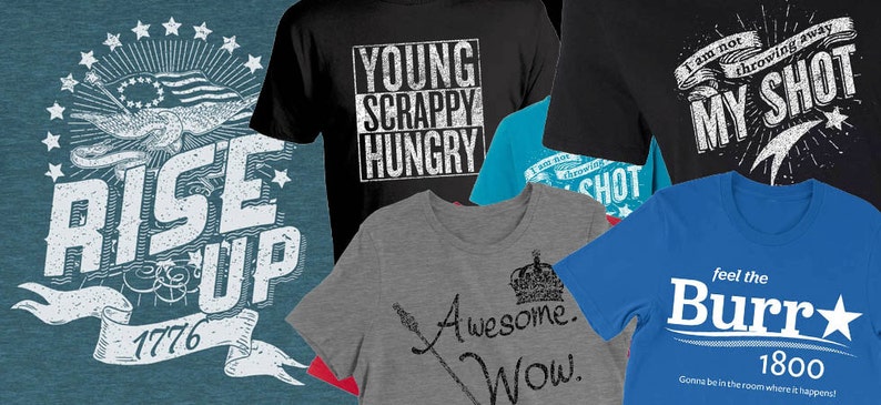 May include: A collection of six t-shirts with various designs and slogans. The shirts feature a blue and white design with the text "Rise Up 1776", a black shirt with the text "Young Scrappy Hungry", a blue shirt with the text "I am not throwing away my shot", a grey shirt with the text "Awesome. Wow." and a crown, a blue shirt with the text "Feel the Burr 1800 Gonna be in the room where it happens", and a red, white, and blue shirt with the text "I am not throwing away my shot".