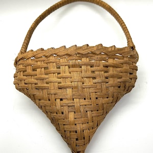 May include: A rustic wooden sign with the text "Welcome to our home" in white lettering. The sign features a distressed finish and a simple, inviting design, perfect for entryway decor.