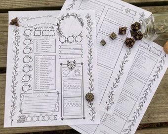 May include: Two printable character sheets for a role-playing game, featuring a wolf illustration and a floral border. The sheets are printed on white paper and are lying on a wooden surface. There are also several dice and a glass jar with cork stopper on the surface.