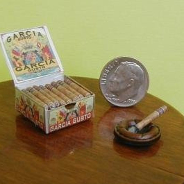 miniature cigars in box with ash tray.