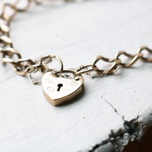 9 ct Gold Curb Chain Bracelet with Heart Padlock Clasp and safety chain