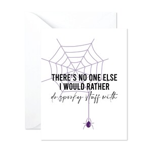 May include: A white greeting card with a purple spiderweb design and a purple spider. The card has the text "THERE'S NO ONE ELSE I WOULD RATHER do spooky stuff with."