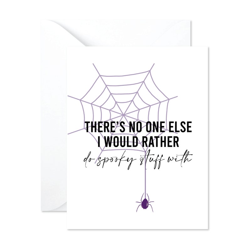 May include: A white greeting card with a purple spiderweb design and a purple spider. The card has the text "THERE'S NO ONE ELSE I WOULD RATHER do spooky stuff with."