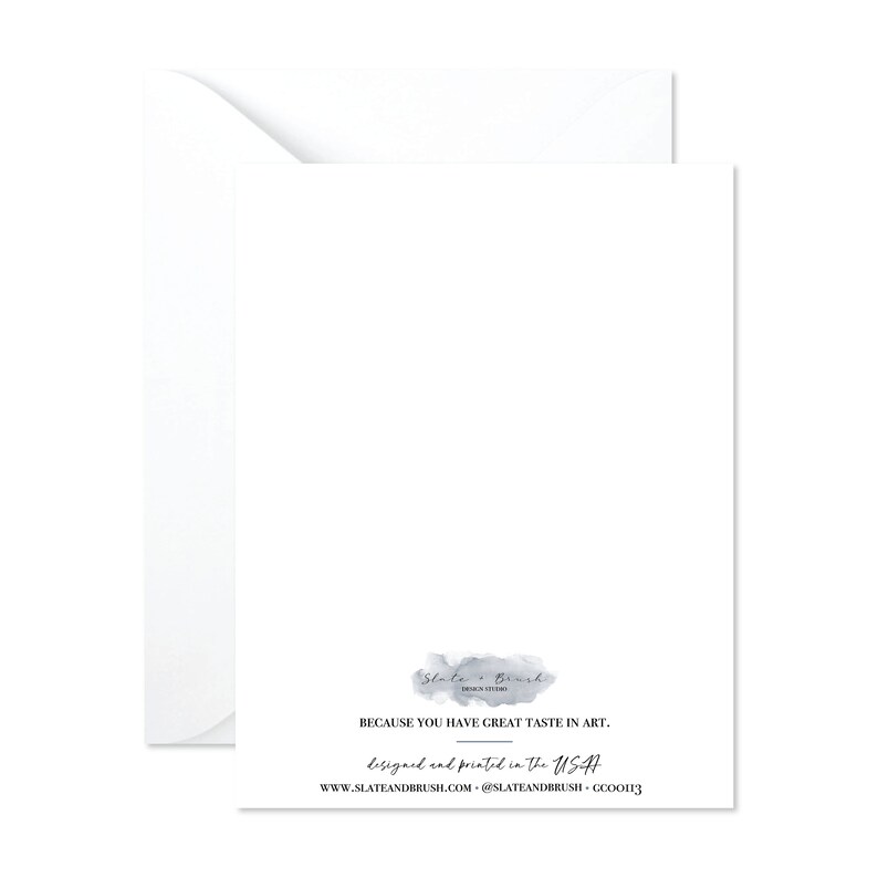 May include: A white greeting card with a matching envelope. The card features text that reads "BECAUSE YOU HAVE GREAT TASTE IN ART." and "designed and printed in the USA." The Slate & Brush logo is also visible.