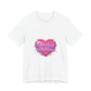 May include: White t-shirt featuring a pink heart graphic with the text "Too Pretty To Pretend" in a bubble font. The heart is outlined in silver with blue accents and starbursts. A casual, everyday wear tee.