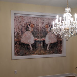 May include: A pair of white window blinds with a floral pattern and a mirrored image of a ballerina in a pink tutu. The blinds are framed in white and are hung in a room with a chandelier.