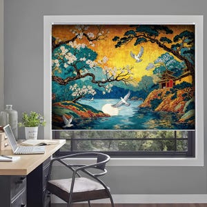 May include: A window roller shade featuring a vibrant landscape illustration with a golden sky, dark pine trees, white cherry blossoms, a pagoda on a rocky cliff, a large white moon, and several white birds flying over a blue lake.