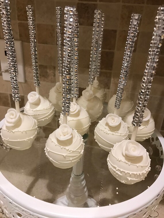 White Dipped and Drizzled Cake Pops with White Sprinkles and Edible White Rose On Bling Stick Il_570xn