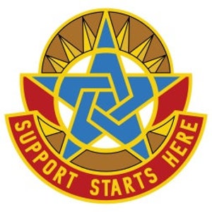 May include: A gold and red patch with a blue star in the center. The star has a smaller blue star inside of it. The patch has the words "Support Starts Here" around the outside.