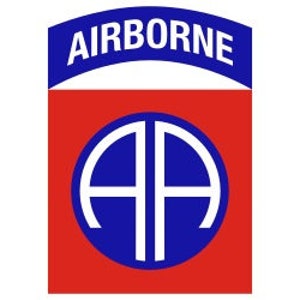 May include: A red and blue patch with the word "AIRBORNE" in a blue arch above a blue circle with the letters "AA" in white.