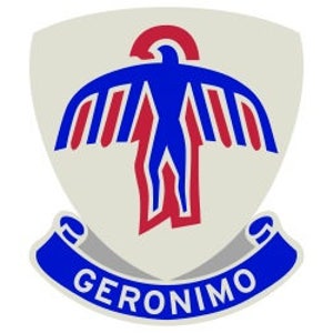 May include: A white shield with a blue and red stylized bird design. The shield has a blue banner with the word "GERONIMO" in white letters.