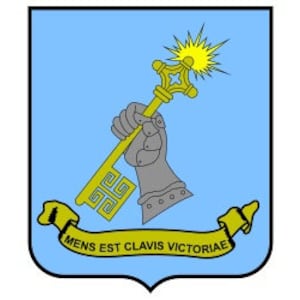 May include: A blue and gold shield with a stylized hand holding a key with a star at the top. The shield has a yellow banner at the bottom with the text "MENS EST CLAVIS VICTORIAE".