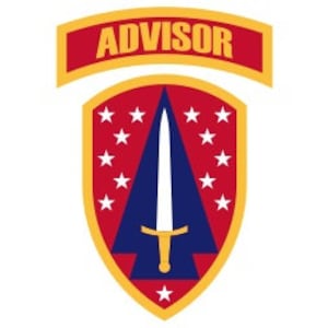 May include: A red and blue shield with a white star at the bottom and 12 white stars around the edge. A white sword with a gold hilt is centered on the shield. The shield is surrounded by a gold border. The words "ADVISOR" are printed in yellow on a red banner above the shield.
