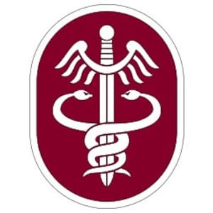 May include: A white medical symbol with a sword and two snakes intertwined, on a maroon oval background.