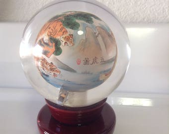 Glass orb with Chinese art