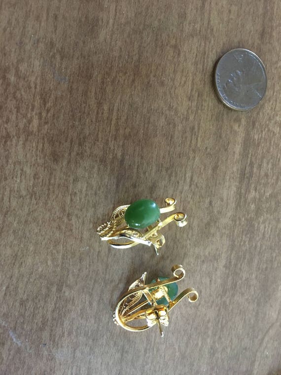 Gold earrings with green stone