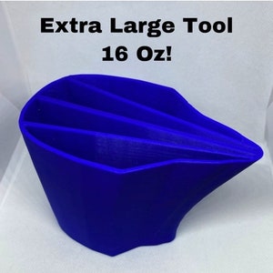May include: A bright blue, extra large, 16 ounce tool with three compartments. The tool is made of a smooth, plastic material and has a unique, angular design.