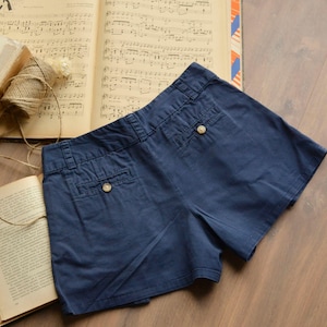 Size 4 | navy blue 90s vintage pegged shorts | mid waist pleated summer shorts | buttoned back pockets minimalist vacation wide legs