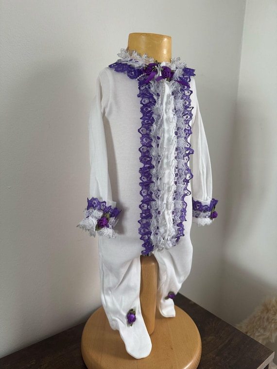 baby grow with frilly trim finish