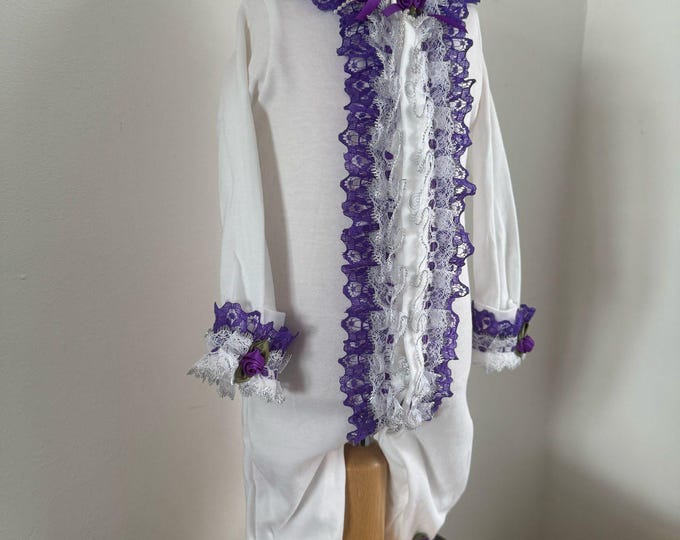 baby grow with frilly trim finish