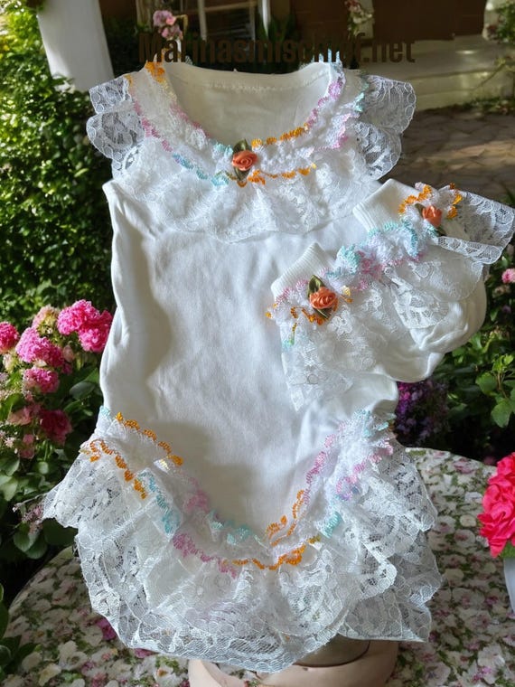 baby grow with multi coloured lace and matching socks