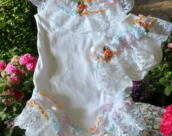baby grow with multi coloured lace and matching socks