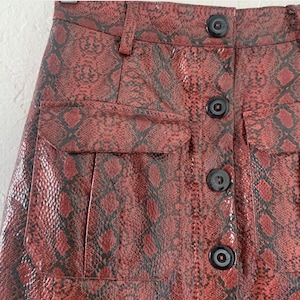Urban Outfitters vinyl snake mini skirt image 1