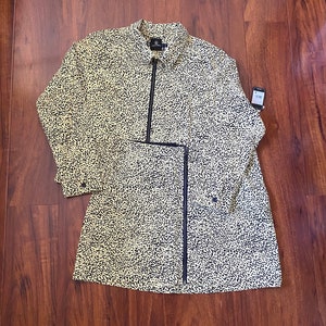 May include: A yellow and black leopard print shirt with a zipper closure. The shirt has long sleeves and a collar.