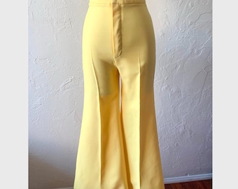 May include: A pair of high-waisted, wide-leg, yellow pants with a flared hem.