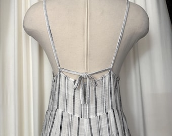 Mono con corbata espacial L