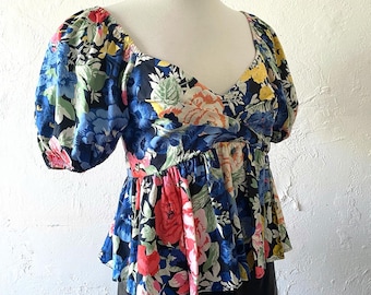 Top babydoll floral de Zara