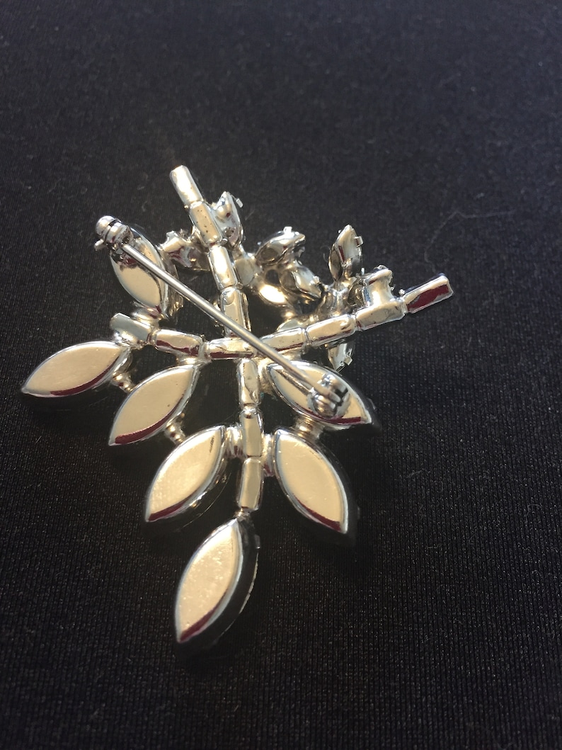 Vintage clear and sapphire rhinestone flower and leaves brooch