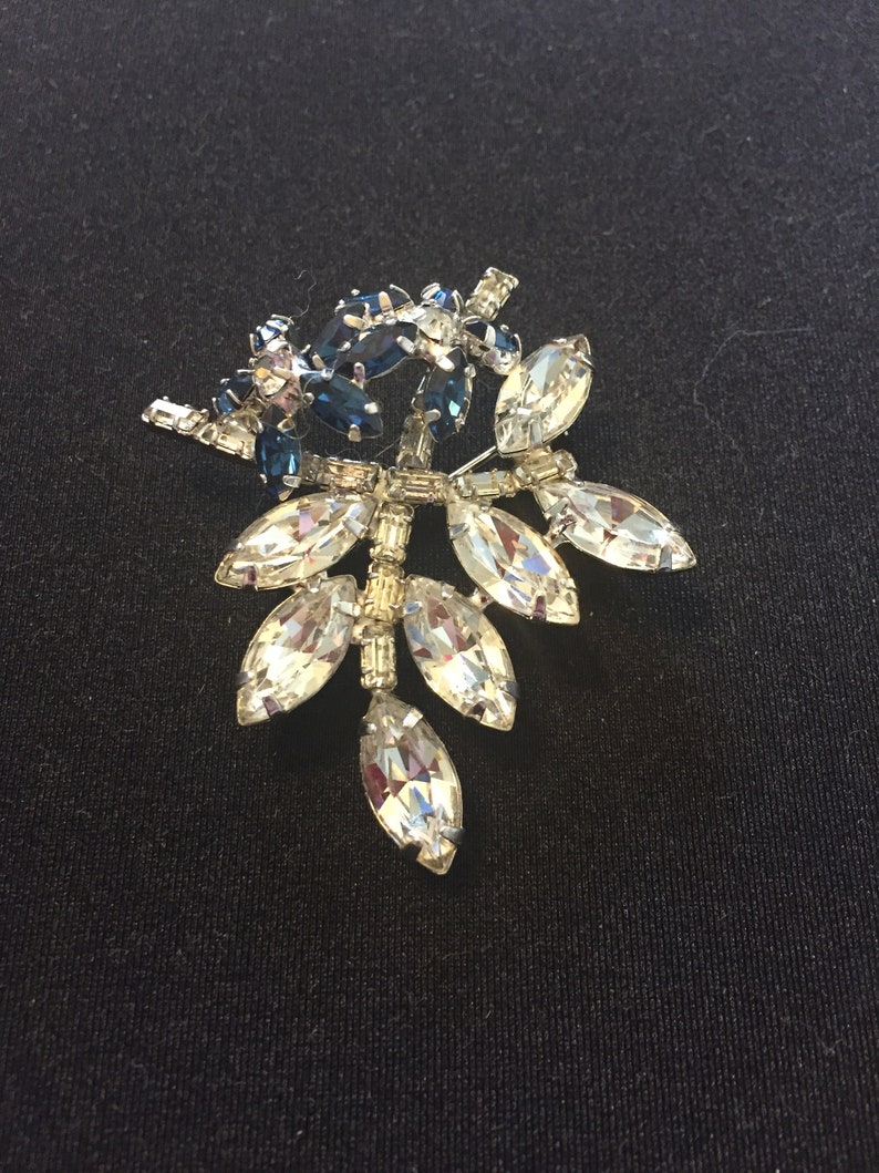 Vintage clear and sapphire rhinestone flower and leaves brooch