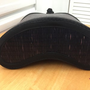 May include: Black woven basket with a black fabric lining and a black fabric handle.