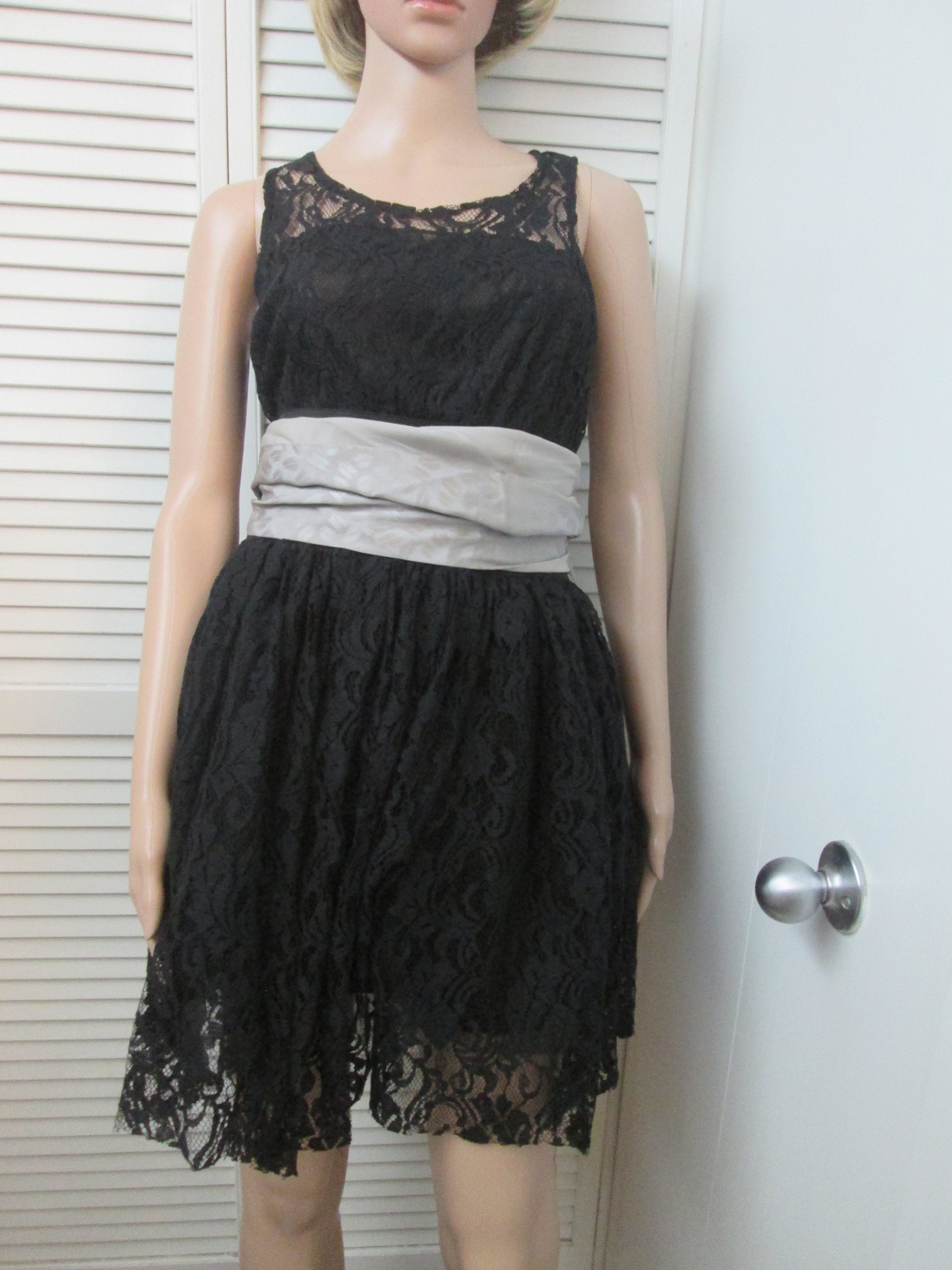 Black lace short lace dress with wide elastic waist and crinoline underskirt. Endless possibilities for this classic sleeveless short dress