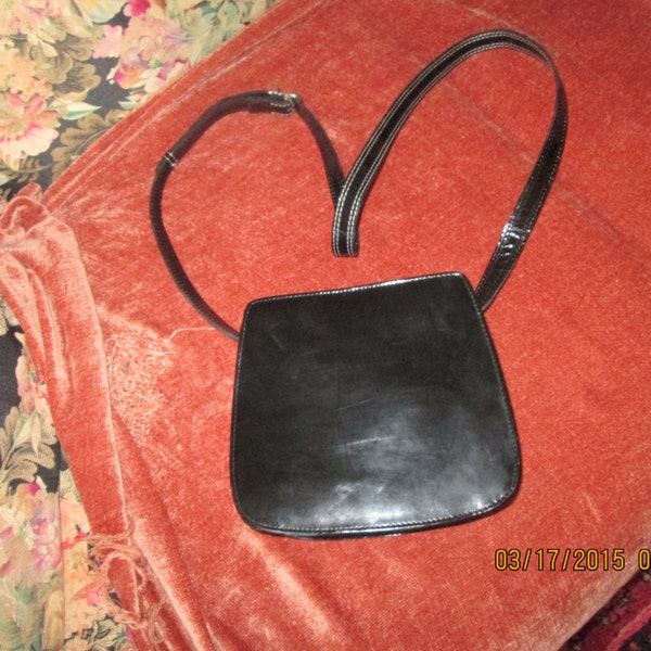 Smooth black leather vintage  Laura Ashley crossbody shoulder purse with white stitching adjustable strap. Classic timeless small crossbody