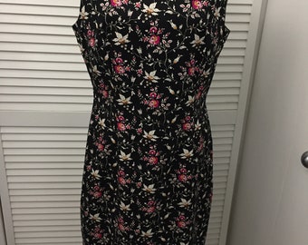 Vintage Maggie London sleeveless form fitting sheath dress 97 cotton 3 spandex black w small floral print. Show off those curves dress Sz 12