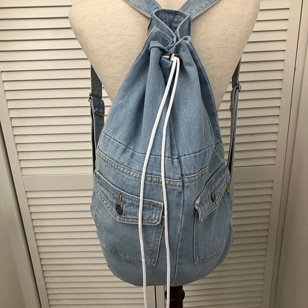 Light denim backpack large drawstring duffel bag style adjustable straps Unisex go everywhere carryall backpack Recycled jean material