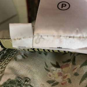 May include: A white care label with the text "Professional Dry Clean" and a "P" in a circle.