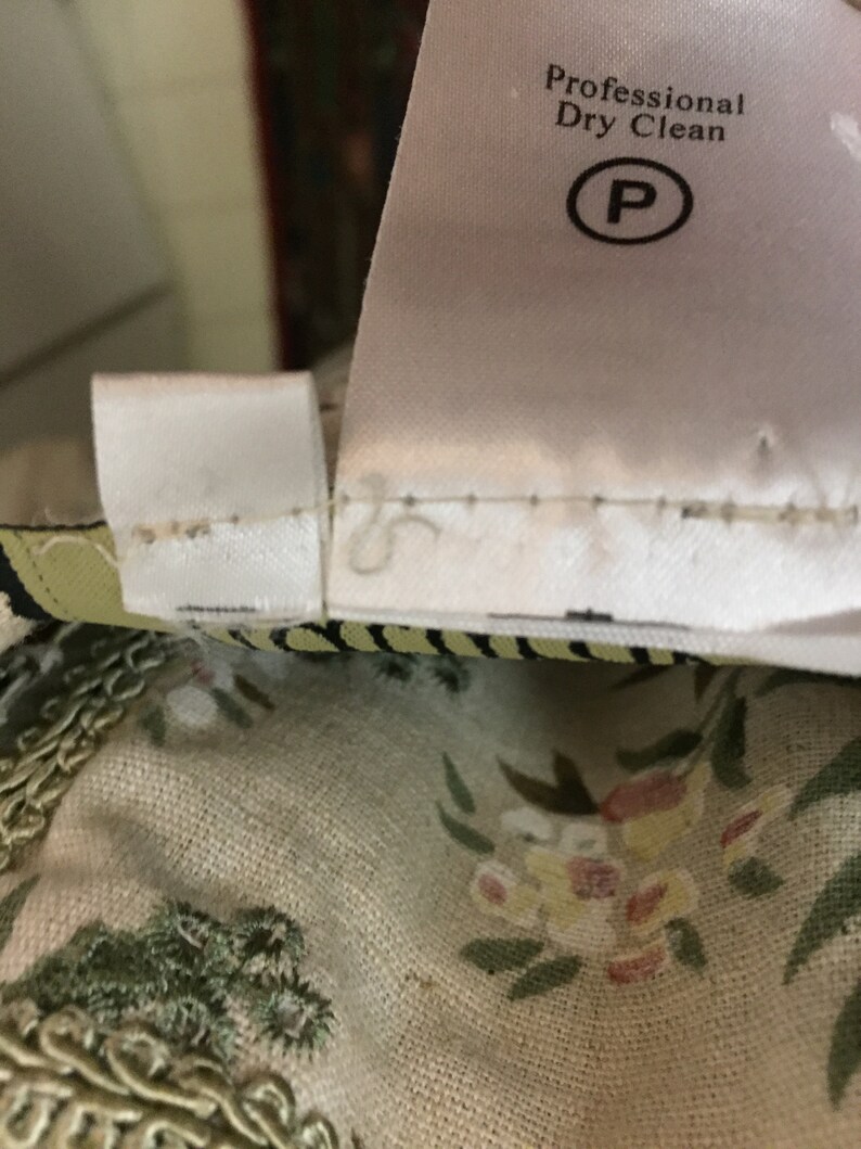 May include: A white care label with the text "Professional Dry Clean" and a "P" in a circle.