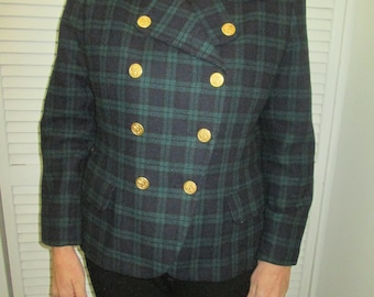 May include: A black and green plaid blazer with a velvet collar and gold buttons. The blazer has a double-breasted closure.