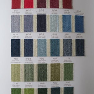 May include: A color chart of yarn samples, with each color swatch labeled with a number and a descriptive name. The colors range from red, orange, yellow, green, blue, purple, and brown.