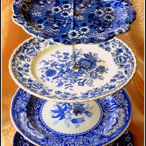 Striking four tier handmade chic cake stand made of best English branded china large various shades of blue and white floral pattern plates
