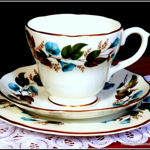 Stunning, refined fine bone china vintage tea trio: tea cup, saucer and cake plate &quot;Morning Glory&quot; by Duchess with rich floral pattern