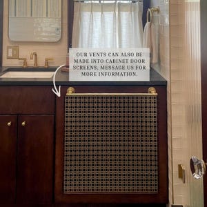 Custom metal vent cover used as wall decor in minimalist interior space