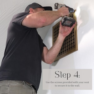 May include: A person using a drill to install a decorative brass vent cover on a white wall. The vent cover has a geometric pattern. The image includes the text "Step 4: Use the screws provided with your vent to secure it to the wall."