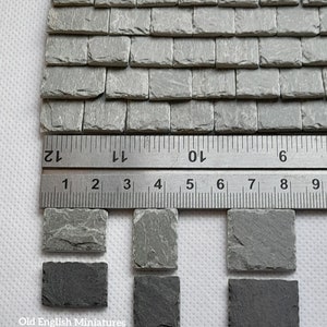 Real miniature vintage rustic tiny slate roof tiles for doll house or any miniature building projects,  hand crafted by Old English Miniatures from reclaimed materials,  hand split and feather edged,  great for other miniature building projects like model making, architectural models, model castle, dolls house floor,  the ruler gives an idea of the size