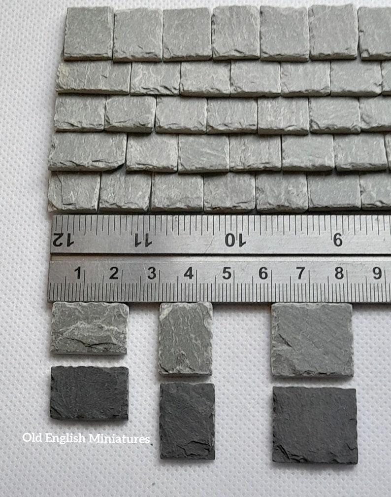 Real miniature vintage rustic tiny slate roof tiles for doll house or any miniature building projects,  hand crafted by Old English Miniatures from reclaimed materials,  hand split and feather edged,  great for other miniature building projects like model making, architectural models, model castle, dolls house floor,  the ruler gives an idea of the size