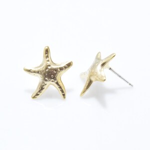 May include: A pair of gold-tone starfish stud earrings. The earrings are simple and elegant, and would make a great gift for anyone who loves the beach.